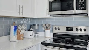 Coffee/tea maker, fridge, microwave, oven