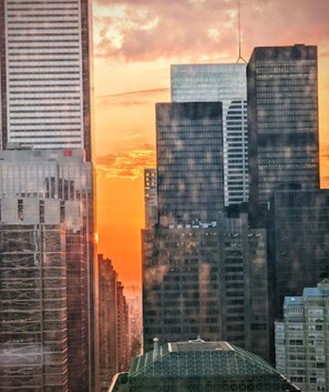 Experience the vibrant cityscape with a mix of modern architecture and diverse building heights.