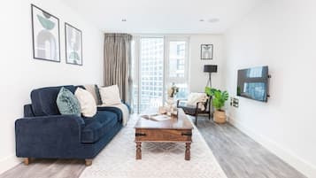 City Apartment | Living area | 40-inch Smart TV with satellite channels