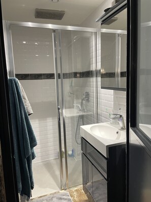 Shower, hair dryer, towels, soap