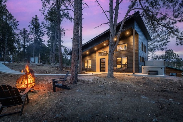 Escape to serenity at our pond-side cabin complete with a cozy hot tub and inviting fire pit for the ultimate relaxation retreat