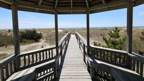 A wooden gazebo with a wooden deck leading to the beach. - Beautiful Great Island Ocean Club Home (2368) (Yarmouth)