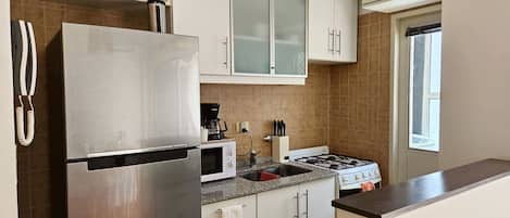 Fridge, stovetop, cookware/dishes/utensils