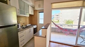 Fridge, stovetop, cookware/dishes/utensils