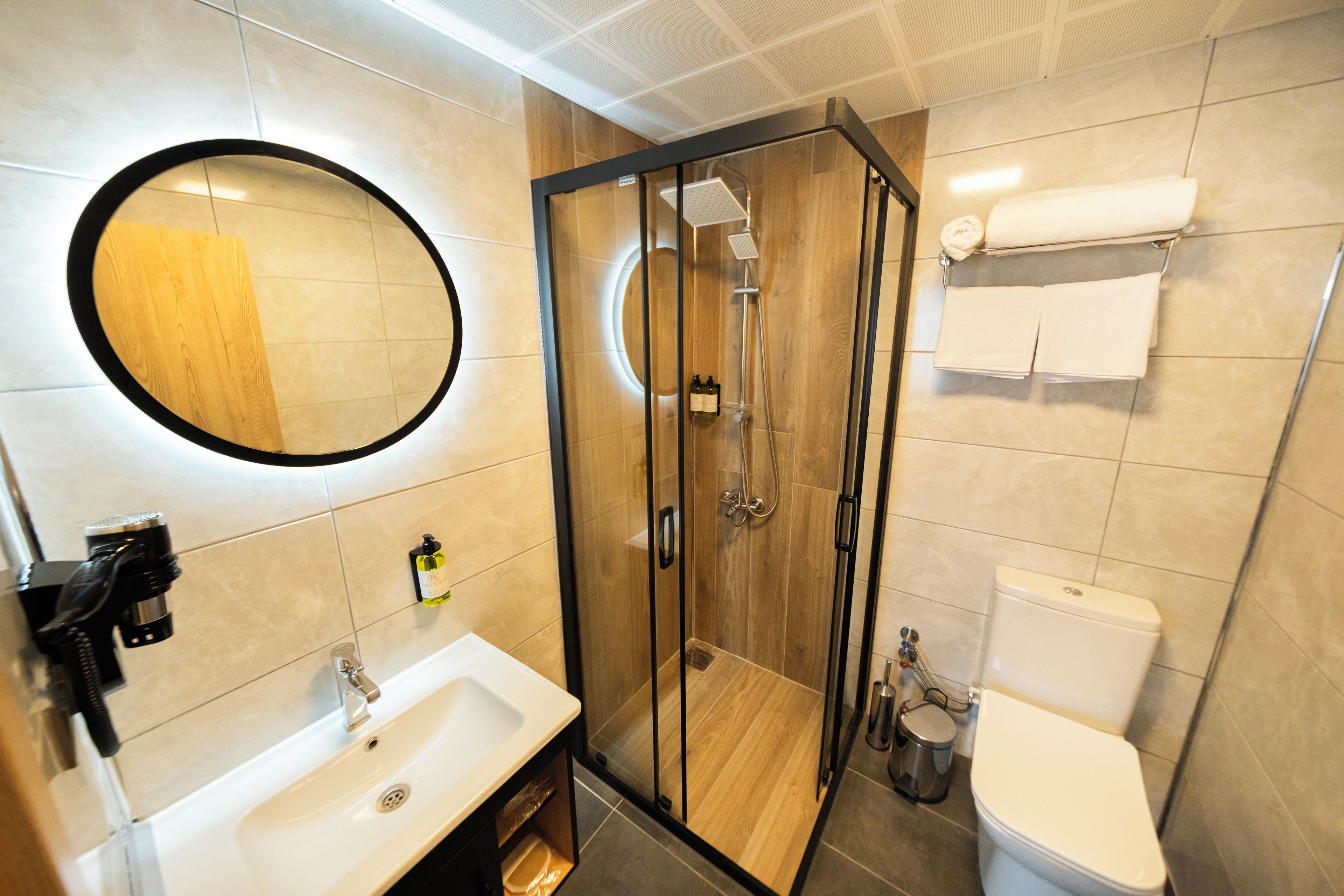 Deluxe Room | Bathroom | Hair dryer, slippers, towels, soap
