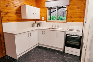 Fridge, microwave, stovetop, cookware/dishes/utensils