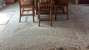 A dining room with a wooden table and chairs, a chandelier, and a cabinet. - Quiet Getaway 5 minutes from Galesburg with pool and hot tub (Galesburg)