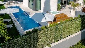 A modern two-story house with a swimming pool, outdoor seating, and a view of mountains. - Exclusive Villa Calma II - heated pool&spa sea view, quiet area family Paklenica (Starigrad)