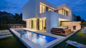 A modern two-story house with a swimming pool, outdoor seating, and a hot tub. - Exclusive Villa Calma II - heated pool&spa sea view, quiet area family Paklenica (Starigrad)