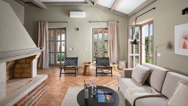 A spacious living area with a fireplace, a sofa, two chairs, and a coffee table. - Rustic Villa Reichardia with a pool in Istri, panoramic view, pet friendly (Sveti Lovrec)