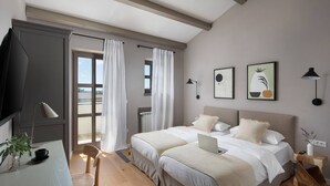 A bedroom with a bed, a desk, a chair, a laptop, and a window with curtains. - Rustic Villa Ruta with a pool in Istri, panoramic view, pet friendly, quite area, family, private parking, terrace, fancy yard (Sveti Lovrec)