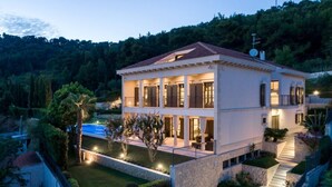A two-story building with a swimming pool, stone pathways, and a well-maintained garden. - Exclusive Villa Marnano - Split, sea view, near center, concierge services, jacuzzi (Split)