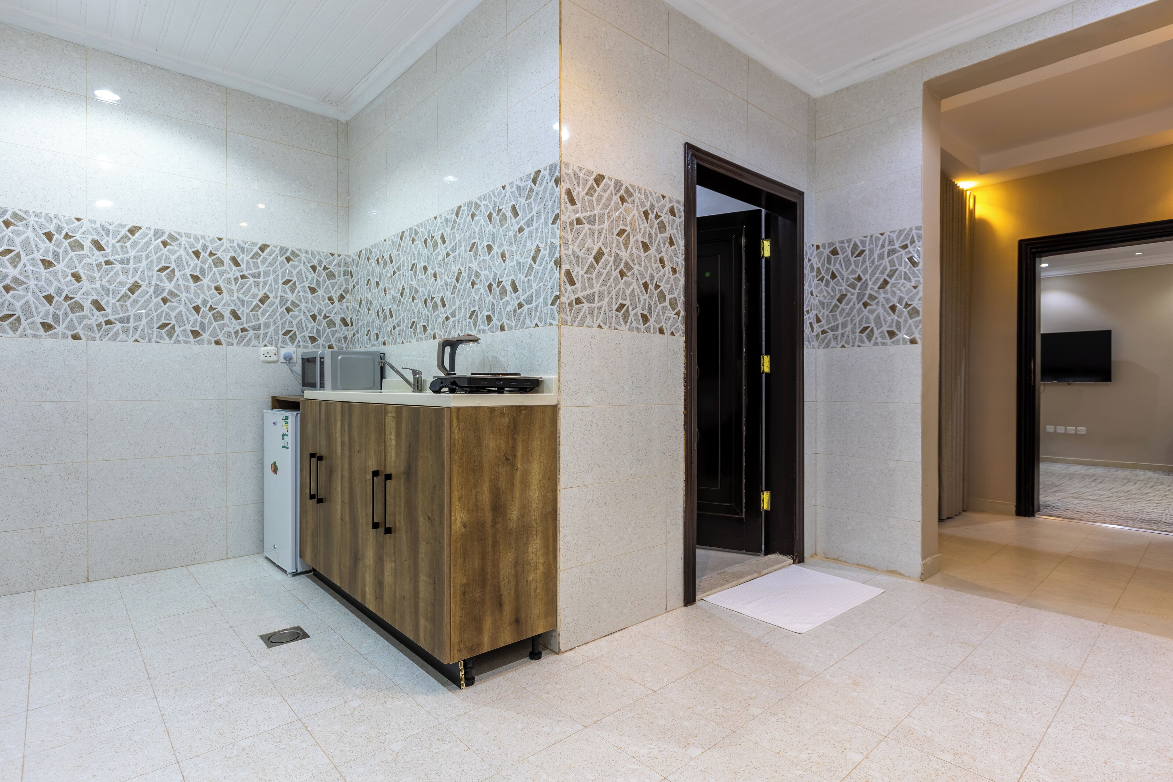 Deluxe Apartment, 2 Bedrooms | Private kitchen | Mini-fridge, microwave, electric kettle, dining tables