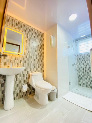 Shower, towels, soap, toilet paper