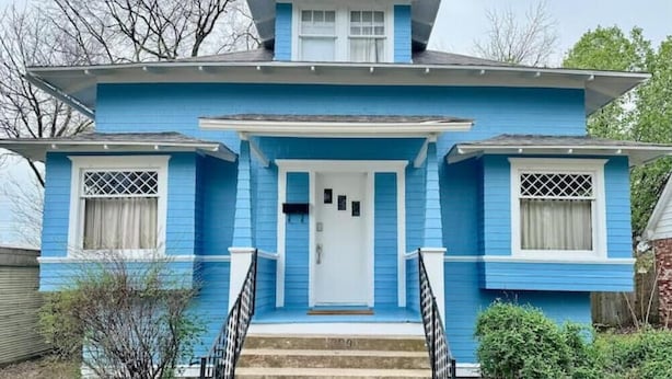 A two-story house with a front porch, a central door, and a staircase leading to the entrance. - Walk to the Mercantile, downtown, Osage Nation offices, Osage Tribal Museum! (Pawhuska)