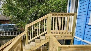 A wooden deck with a staircase leading to a second level. - Walk to the Mercantile, downtown, Osage Nation offices, Osage Tribal Museum! (Pawhuska)