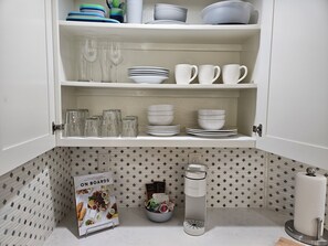 Guests can enjoy ample storage and convenient amenities in this well-organized kitchen.