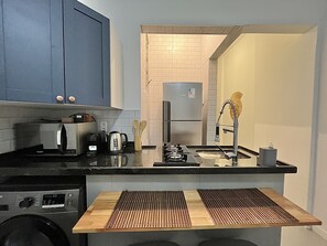 Fridge, microwave, stovetop, coffee/tea maker