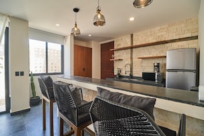 Private kitchen - Tulum Retreat: 2-BR Apartment, Rooftop Pool, Modern Comforts (Tulum)