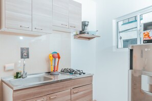 Fridge, microwave, espresso maker, coffee/tea maker