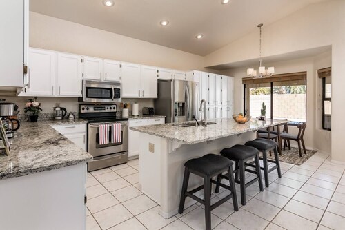 Spacious Sunny Oasis: 4BR, Pool, Games located near Mesa and Gilbert.

