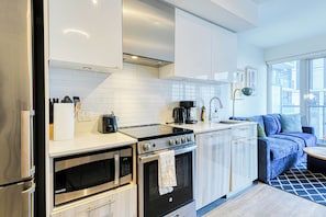 Signature Suite, 2 Bedrooms, Balcony | Living area