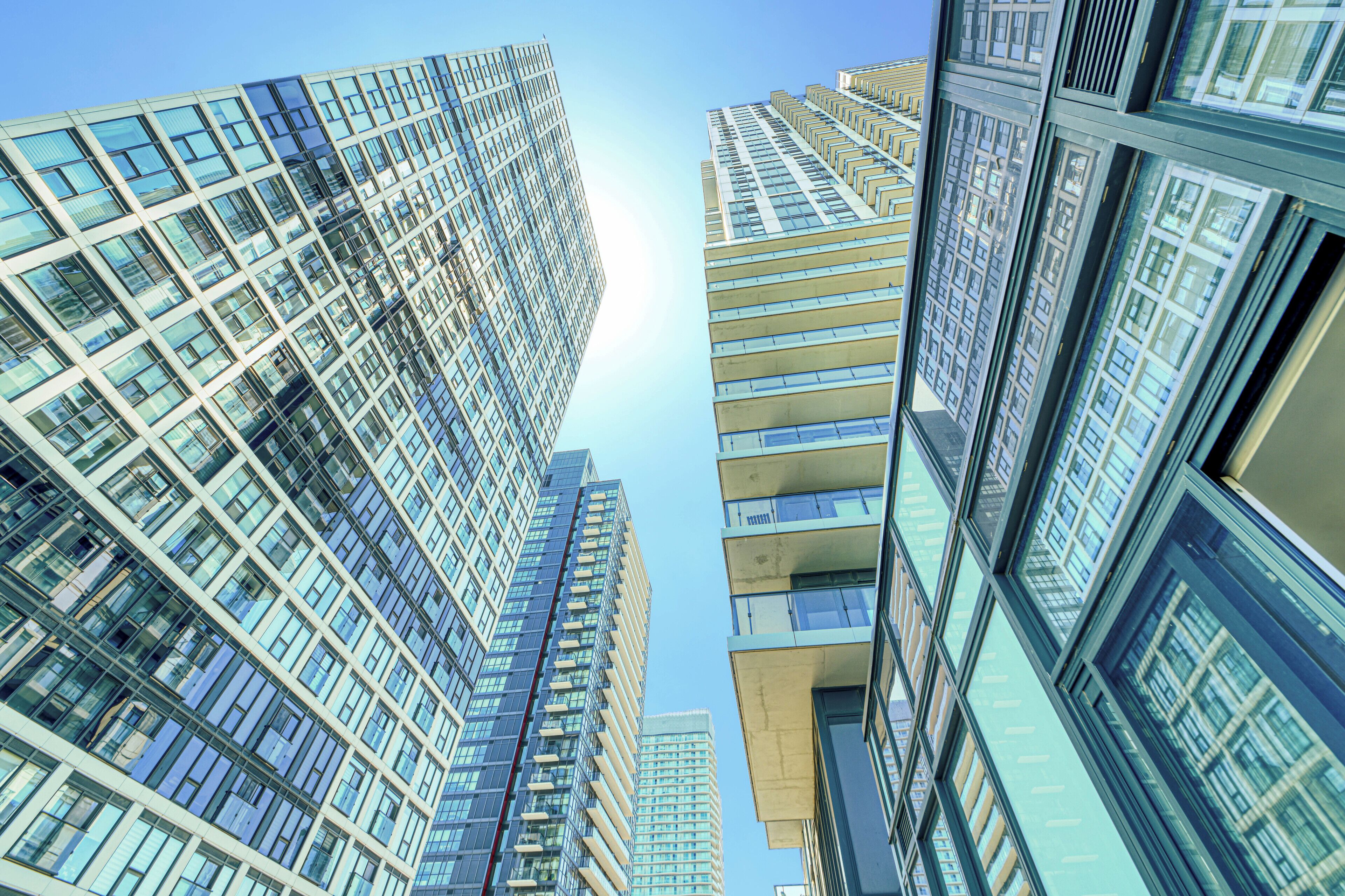 A high-rise building with multiple floors and large windows.