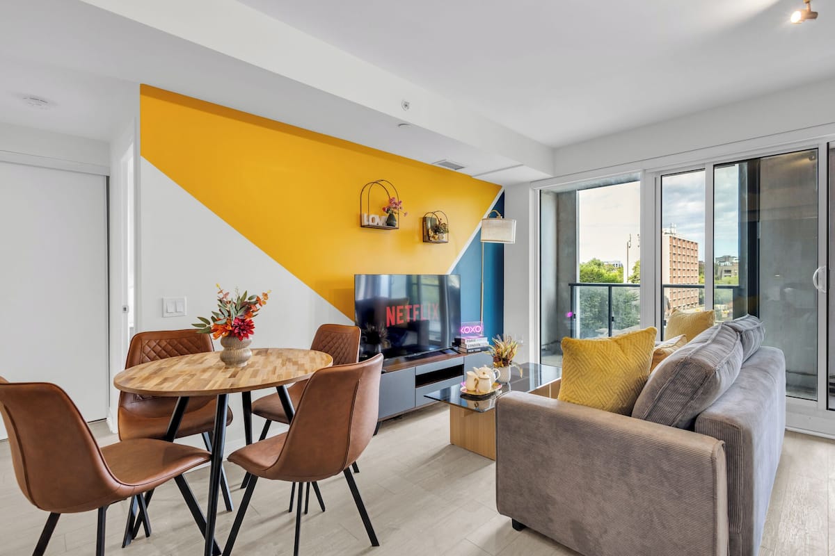 Elite Suite, 2 Bedrooms, Balcony, City View | Living area | 50-inch Smart TV with digital channels, Netflix, Hulu