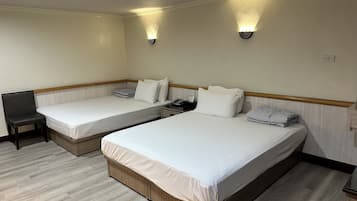 Business Quadruple Room | Living area | 32-inch LCD TV with cable channels