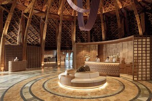 A lobby with a high, bamboo-patterned ceiling, a central seating area, and reception desks. - Garrya Mu Cang Chai (Mu Cang Chai)