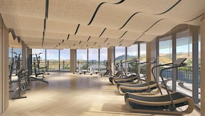 Un gimnasio moderno con equipo de cardio, máquinas de pesas y vistas panorámicas al exterior.