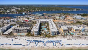 A coastal hotel with multiple buildings, a beach with umbrellas, and a water tower. - Waterscape A533 2Bed 2.5 Bath w Beach Service (Fort Walton Beach)