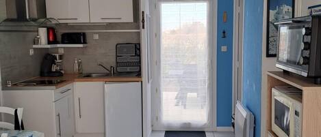 Microwave, stovetop, coffee/tea maker, toaster