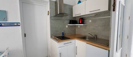 Fridge, microwave, stovetop, coffee/tea maker