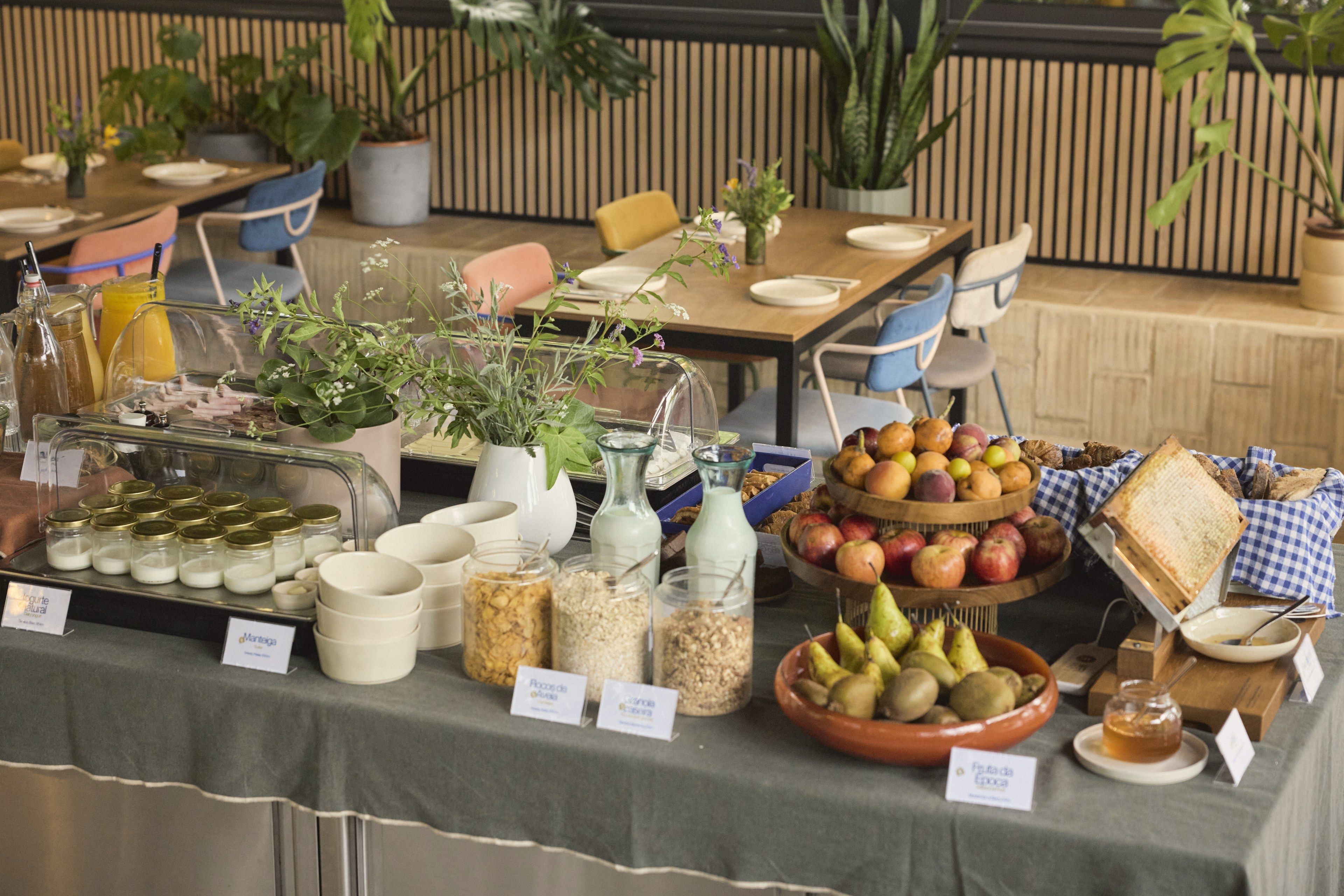 A buffet table with various food items and condiments.