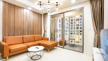 Family Apartment, 3 Bedrooms, City View, Tower | Living area | 43-inch Smart TV with cable channels, Netflix, streaming services