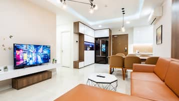Family Apartment, 3 Bedrooms, City View, Tower | Living area | 43-inch Smart TV with cable channels, Netflix, streaming services