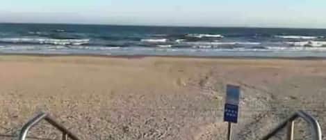 On the beach, sun-loungers, beach towels