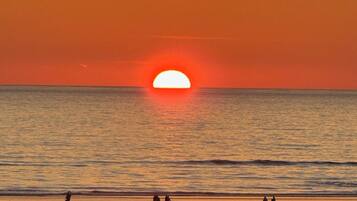 On the beach, sun loungers, beach towels