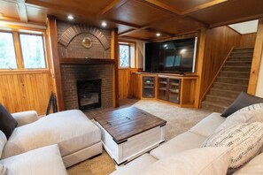 Smart TV, fireplace, books