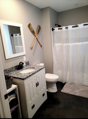 Shower, hair dryer, towels, toilet paper