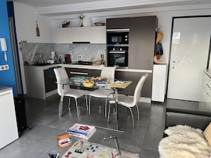 Enjoy cooking in the kitchen with an oven, gas stove, and ample counter space.