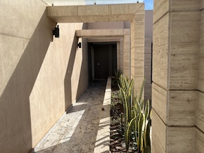 Corridor leading to a doorway.