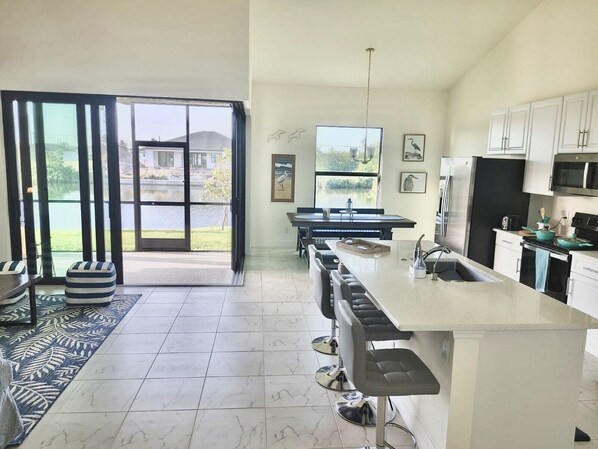 Fridge, microwave, oven, stovetop - New House with Step Free Entry, Canal, Fish, Sunset Views, Near Golf & Baseball. (Cape Coral)