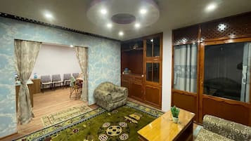 Apartamento Deluxe | Zona de estar