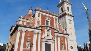 A historic church with a bell tower and a dome.