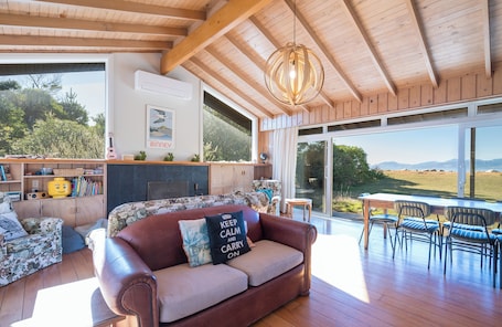 Smart TV, fireplace. Waterfront Classic Kiwi Bach
