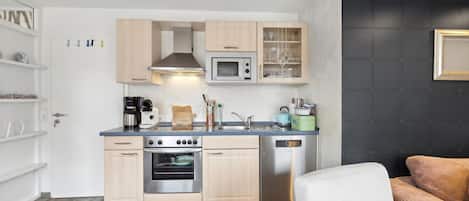 Fridge, stovetop, dishwasher, coffee/tea maker