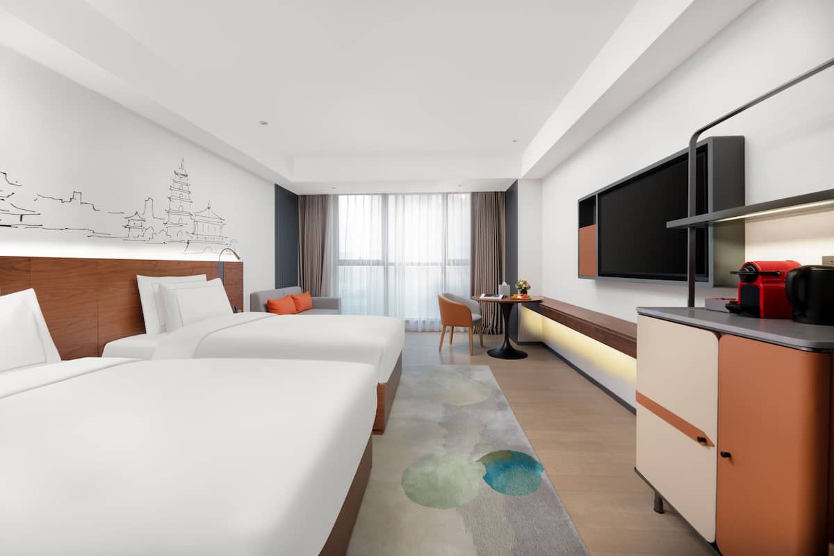 Executive tweepersoonskamer | Luxe beddengoed, donsdekens, een gratis minibar, een bureau