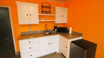 Microwave, coffee/tea maker, dining tables